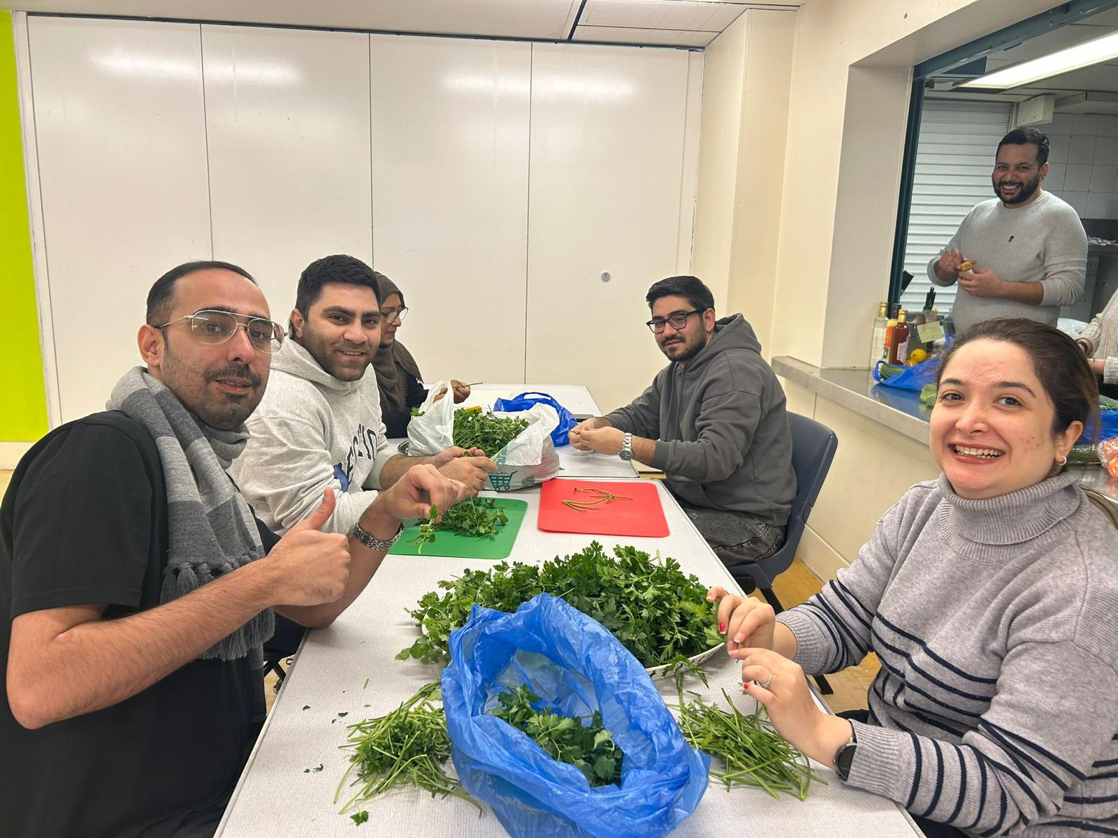 Two women painting mugs