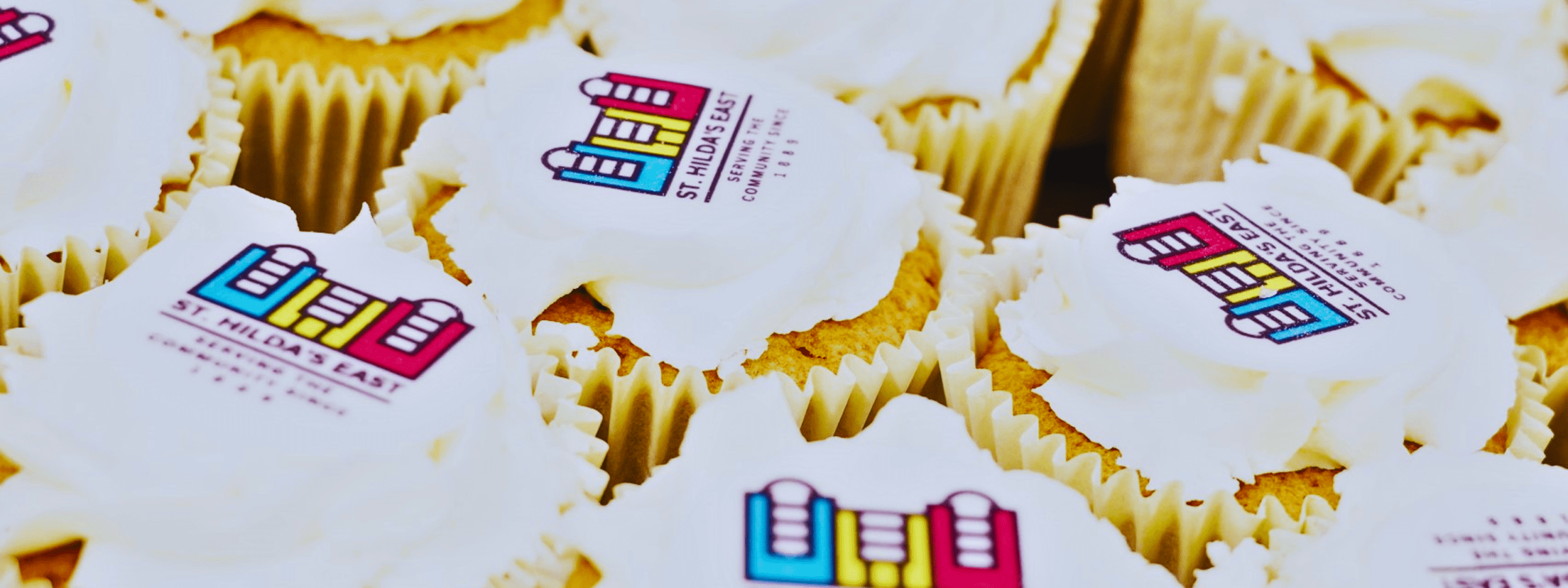 woman smiling by st hildas east history board east london