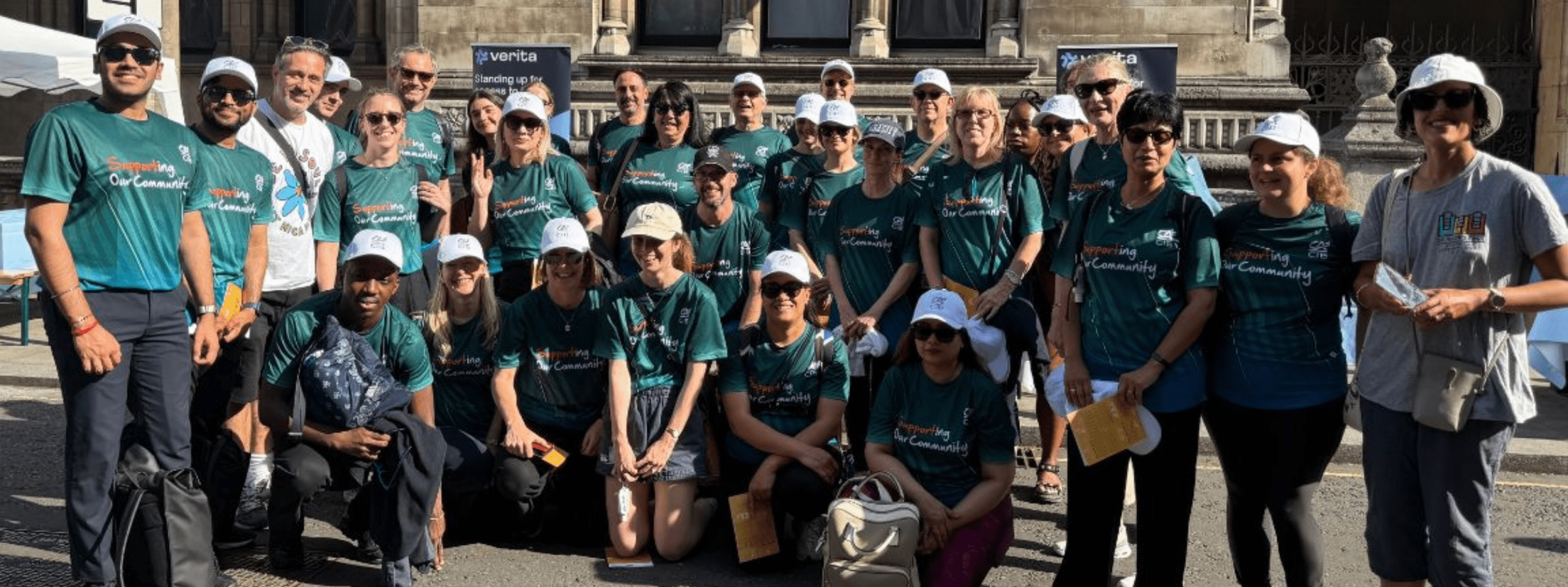 woman smiling by st hildas east history board east london